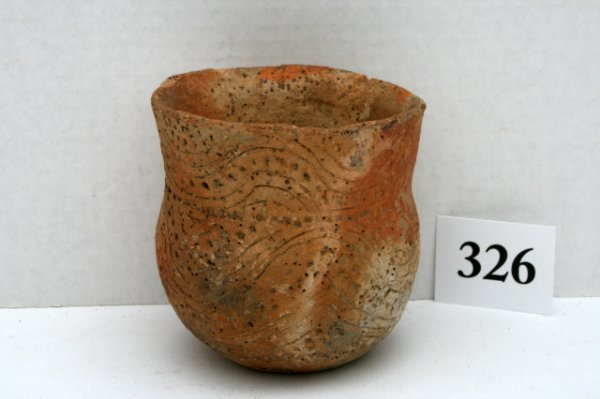 Red Slipped Buff Colored Urn: 4" x 4 1/4" Red Slipped Buff Colored Urn with incised lines and punctuations – dug by Dickinson in 1927 at a depth of two feet in a campsite near Blue Lake about a mile west of the Mound on the Hays