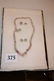 375: 12 x 8 Frame – 18" Strand of Shell Beads
