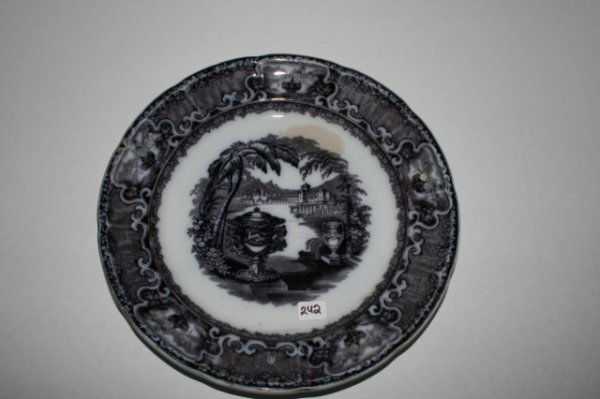 mulberry color plate: 9 ½" early mulberry color plate marked " Washington Vase" by F. W. V. Co. (chip on back)