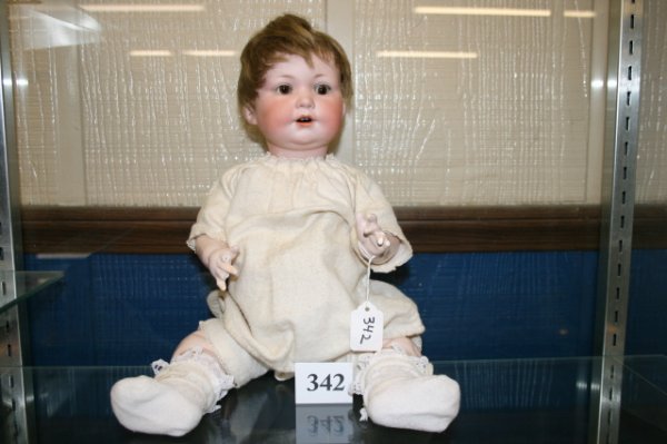 Armand Marseille doll: 17" Armand Marseille doll marked "A M #977 – A7M – DRGM2671 –Made in Germany". Bisque head , composition body, China teeth, light brown hair, weighted sleepy brown eyes, fingers broken on each h