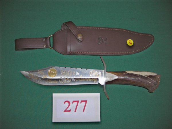 KNIFE: Massive Hen & Rooster Crown Stag handle Bowie, 15" overall. The gold etched blade is commemorating the 160th Anniversary of Hen & Rooster. Only 300 of these were produced