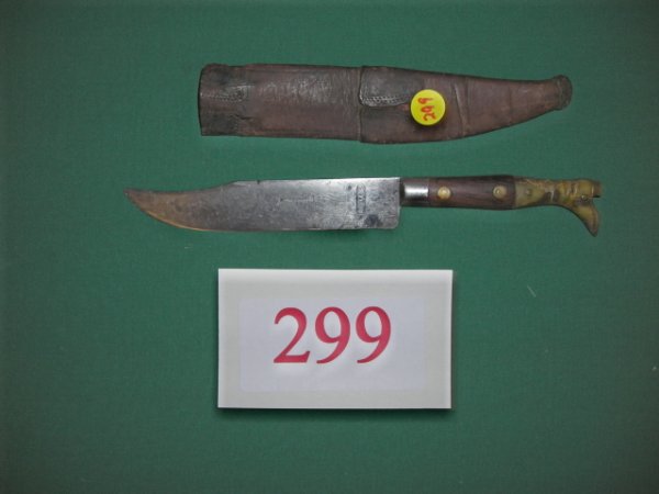 KNIFE: Marked J.J. Paris, this is a fancy little horn handle boot dagger complete with original sheath, 10 ½" overall length. The handle represents a mans leg