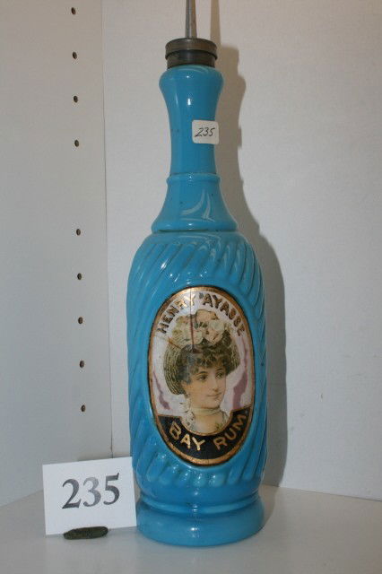 Blue Milk Glass Barber Bottle: Blue Milk Glass Barber Bottle with label under glass "Bay Rum & picture of Victorian Lady – crack in label