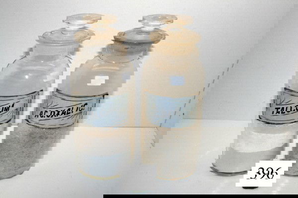 (2) 10" Bottles: (2) 10" Bottles – label under glass – chip on Talcum & AC. Oxalie – original stoppers