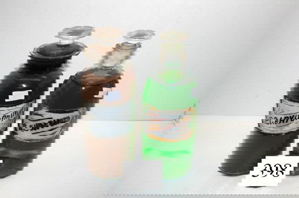 (2) 8 1/4" Apothecary Bottles: (2) 8 1/4" Apothecary Bottles – label under glass Tr. Curcuma & P. Caryophyl – original stoppers