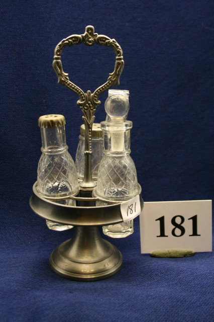 Childs or Miniature Castor Set: Childs or Miniature Castor Set with 3 bottles in pewter type frame