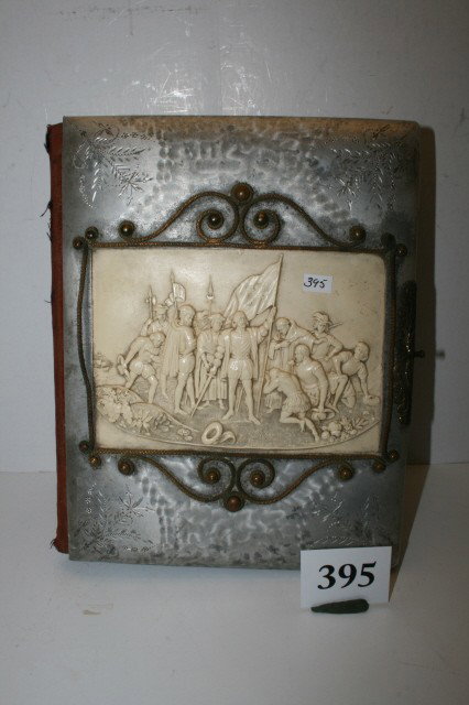 Photo Album with scene: 11" Photo Album with scene of Christopher Columbus Party – in celluloid – missing clasp – 1892