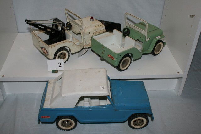 3 Tonka Jeeps: 3 Various Tonka Jeeps including one Jeep Wrecker with Snow-blade Longest 13" (some paint loss)