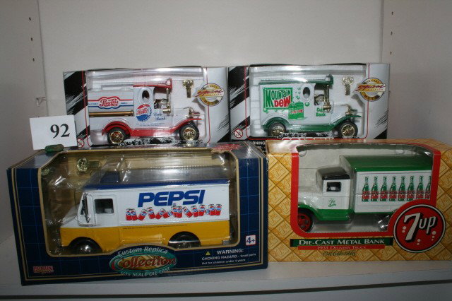 Lot of 4 Collector Banks: Lot of 4 Collector Banks including "Pepsi Cola," "Pepsi," "7-UP," & "Mountain Dew" 6" long in original boxes