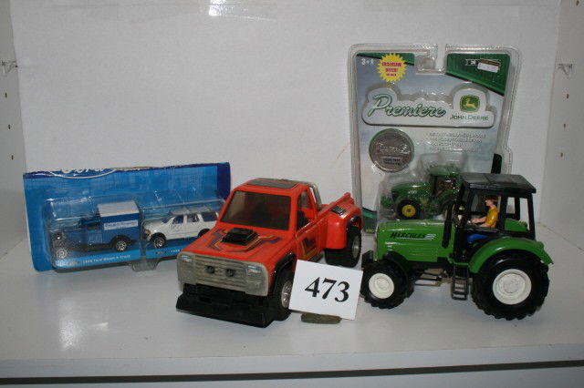 4 Toys, Ford Model A Truck: Grouping of 4 Toys, Ford Model A Truck and Expedition, John Deer Tractor, and Plastic Truck. (minor paint loss)
