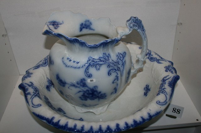 Flow Blue Bowl & Pitcher: Champion Flow Blue Bowl & Pitcher by W.H. Grindley – 1891 – 16 1/4" Bowl has 4" hairline on inside – 10 1/2" Pitcher is mint