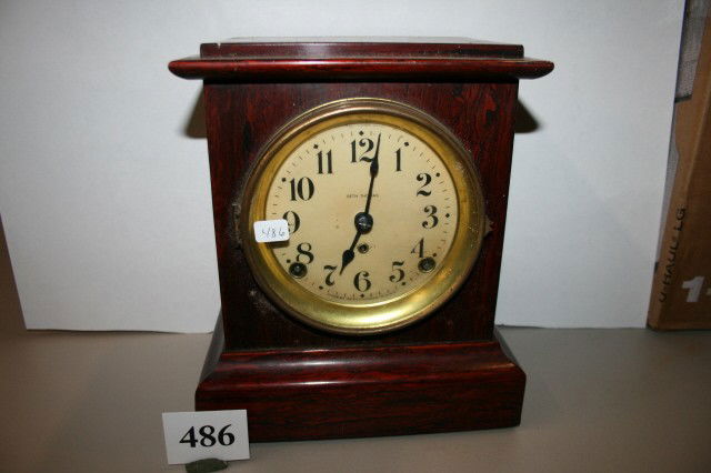 Seth Thomas Mantel Clockcase: 8 x 10" Seth Thomas Mantel Clock – with grained mahogany wood case – has pendulum & key but does not run
