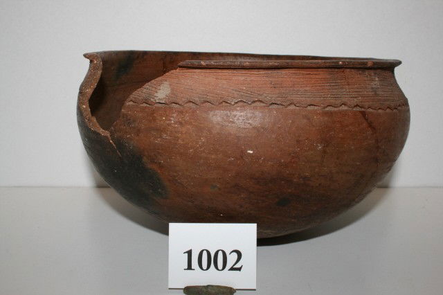 Redware Shell Tempered Bowl: 9 3/4" x 5 1/2" Punctated and Incised Redware Shell Tempered Bowl – has unglued pieces included in plastic bag – origin unknown