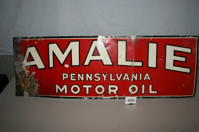 Amalie Pennsylvania Motor Oil Sign: 12" x 36" Amalie Pennsylvania Motor Oil Tin Sign – Red, White, Black – rusted on end