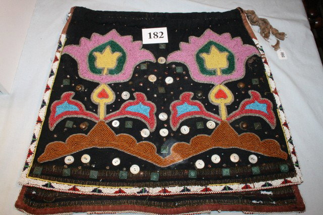 Crow Breech Cloth: 14" x 17" Two Piece Crow Breech Cloth with Floral Beading – decorated with mother of pearl buttons, brass studs, metal sequins, trade cloth construction