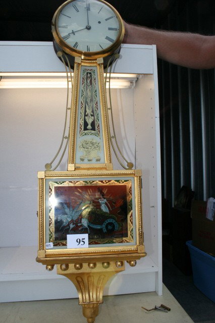 Gold Guilded Banjo Clock: Gold Guilded Banjo Clock 1 weight – Maiden on Chariots Riding scene – reverse painted with gold leaf