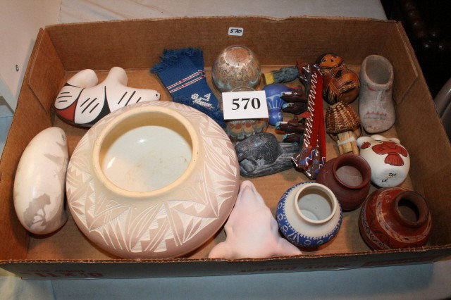 17 assorted Indian Pottery: Box containing 17 assorted Indian Pottery and Souvenir Items including 2 sand painting paper weights, wood canoes, 2 bear figures and carved pottery bowl, nice decorative lot