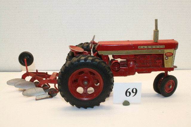 Farmall 560 with 3 bottom plow: Farmall 560 metal rims with 3 bottom plow 13” (EXC)