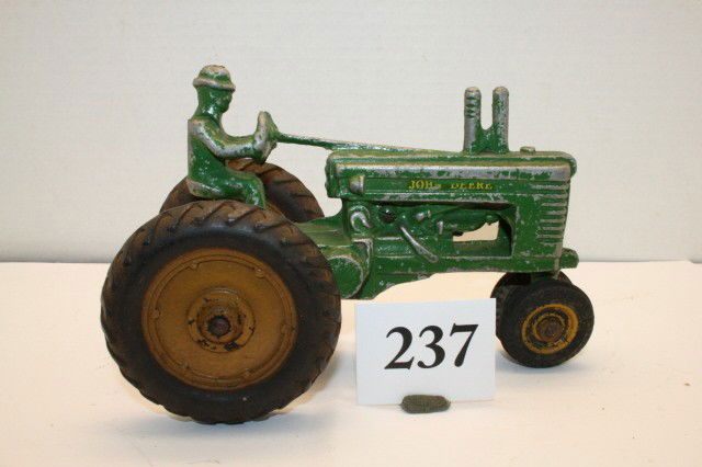 Ertl John Deere A Tractor: Ertl John Deere A Tractor w/open flywheel and arcade front tires 7 ½” (G – VG)