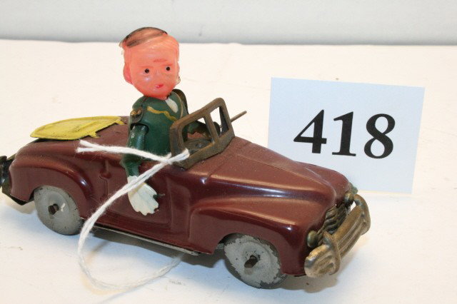 Occupied Japan Key Wind Car: Occupied Japan Key Wind Car w/fig. & celluloid head 4 7/8” (EXC) – when running the driver raises his right hand to signal