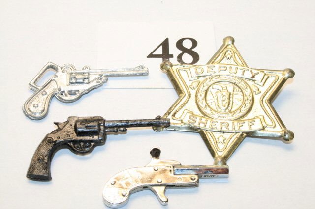 Tin Badge, 3 guns: Tin Badge, 3 guns
