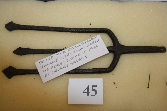 Hand Forged Trident Fish Spear: 10 ½” Hand Forged Trident Fish Spear – found on a Wyandot Village Site 2 ½ miles north of Forest, Hardin Co. Ohio in 1956, Ex. George Halsey