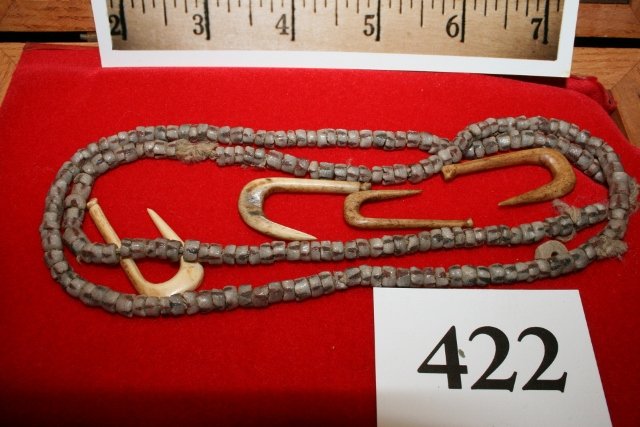 Strand small shell beads: Frame containing a 27” Strand small shell beads and 4 Bone Fish Hooks, excavated by Greg Cumming on Turtle Creek Site, Near Augusta Bracken Co. Kentucky