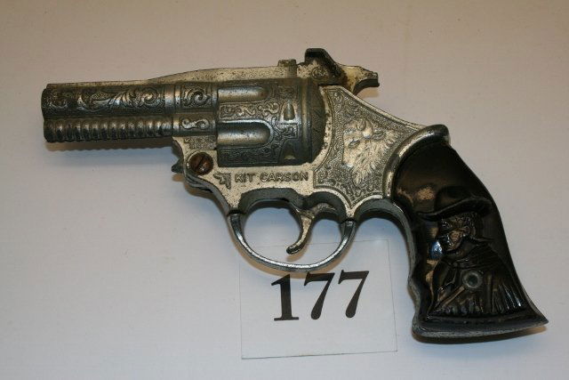 Kit Carson Cap Gun: 7 ¼” Kit Carson Cap Gun by Kilgore – nickel plated die cast – pc. of hammer broken off at end – rough shape