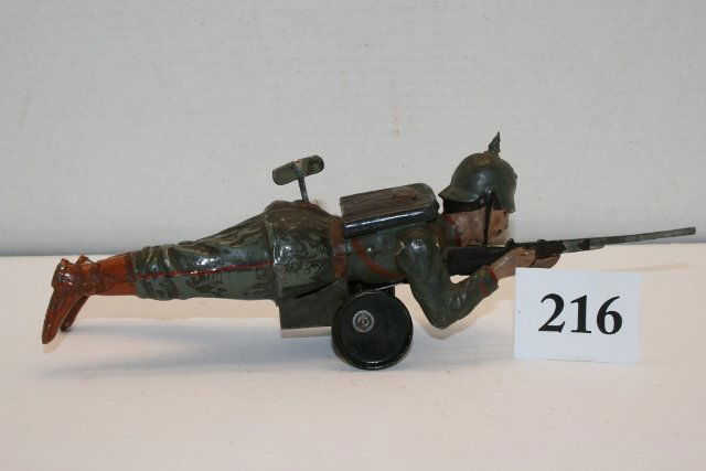 Tin Crawling Wind Up German Soldier Toy: Rare 10 ¾” Tin Crawling Wind Up German Soldier Toy – excellent paint – left hand not soldered to gun – great wind up toy