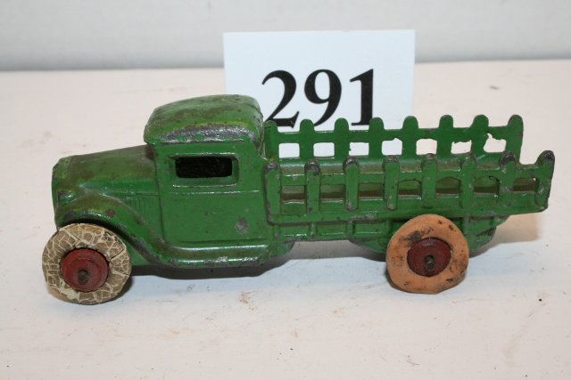 Cast Iron Delivery Truck: 4 ½” Cast Iron Delivery Truck – Green paint with some chips – 1 of the 4 rubber tires replaced – tires in rough shape