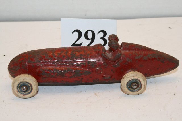 Cast Iron Red Race Car: 5 5/8” Cast Iron Red Race Car with 2 passengers – many chips in paint – partially rusted
