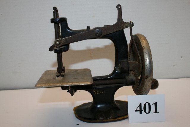 Miniature Sewing Machine: 6 ¼” Tall Metal Miniature Sewing Machine by Singer Manufacturing Co. – partially rusted – average shape