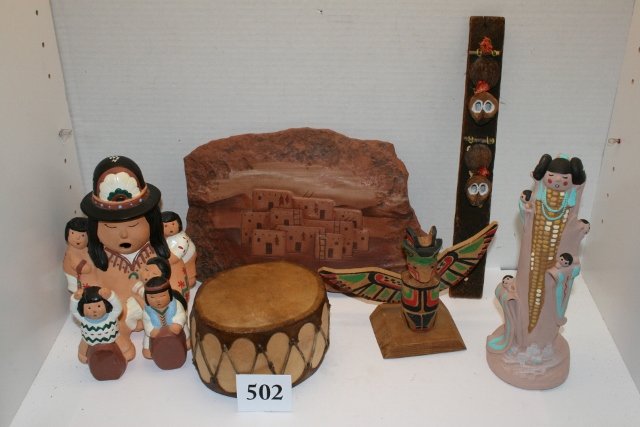 Story Teller Figure: Box containing 5 ½” x 7 ¼” Story Teller Figure, Cast 1996, 4 ¼” x 3 ¼” Cochiti Toy Drum, 9 x 3 ¼” Statue, 11 x 7 ¼” Stone Slab, Painted with Pueblo, Small Totem, Wood Lathe from Pa. 