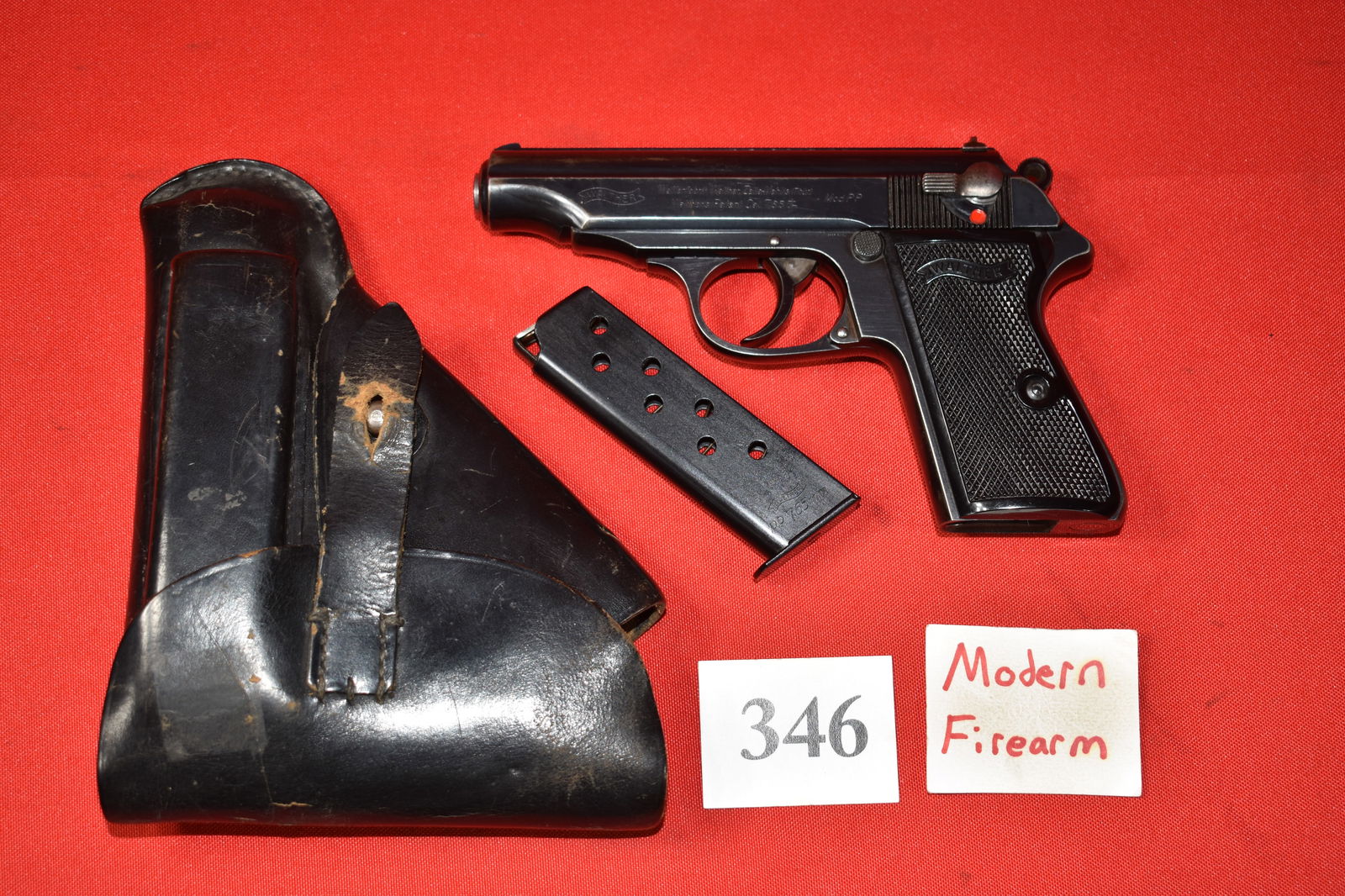 (X) Walther Model PP 7.65 mm/.32 acp Pistol: (X) Walther Model PP 7.65 mm/.32 acp Pistol, SN# 972623 mfg. 1937 with leather holster “Vitousek Hohen-Bruck 1942”, one magazine, 90% excellent condition