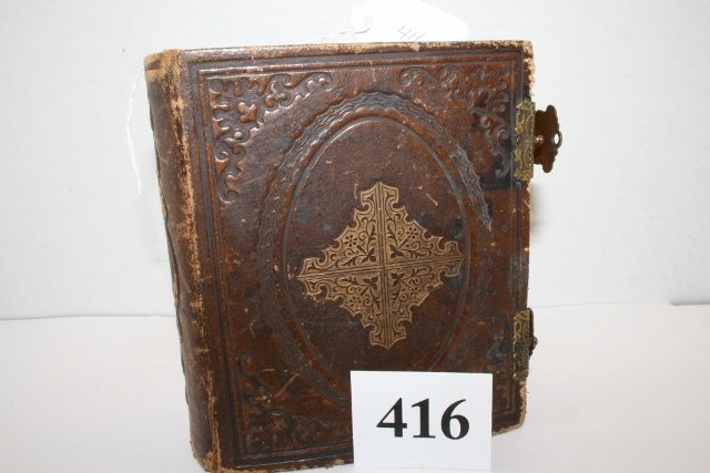 embossed photo album: Leather bound and embossed photo album. Made by W. A. Beers, New Haven, Conn. Album is filled with various types of photos of family members - gold trimmed pages and double clasps