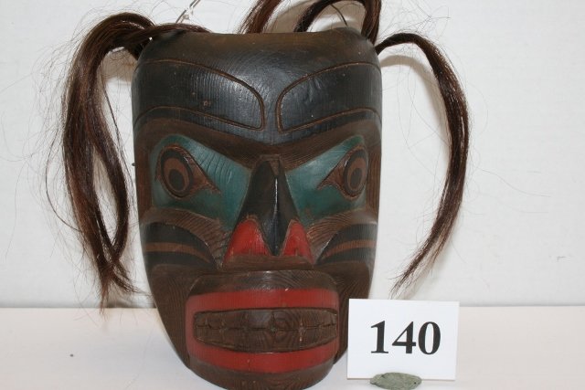 North West Coast Polychrome Mask: 6 ¼” x 4 7/8” Hand Carved Cedar North West Coast Polychrome Mask with hair attachments – signed O.M. Speaker