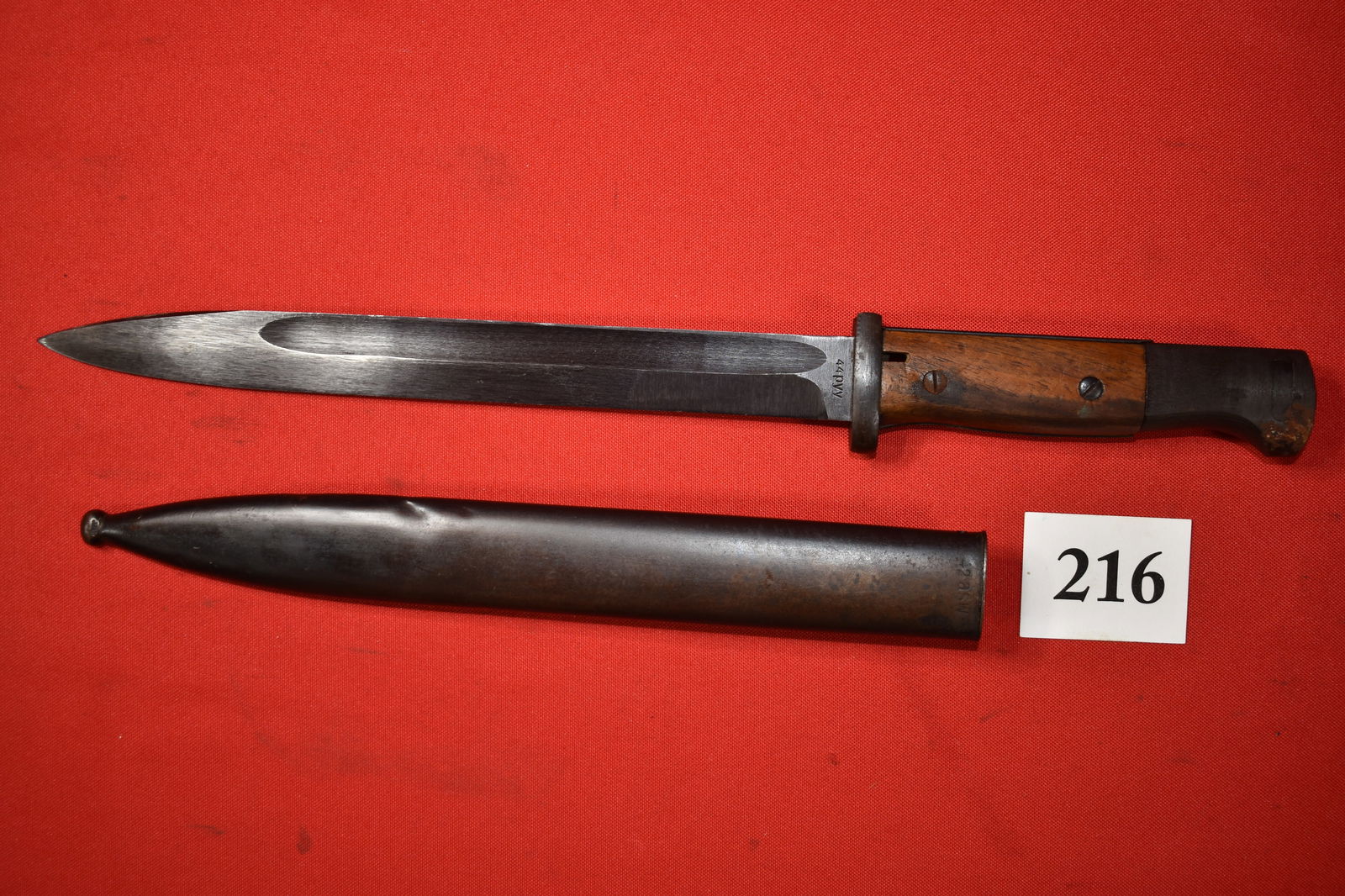 German WWII Nazi K98K Bayonet: German WWII Nazi K98K Bayonet, 44 pyy on blade and 42 asw on scabbard, blade is mint, rust spot on handle mfg. by Berg & Co.