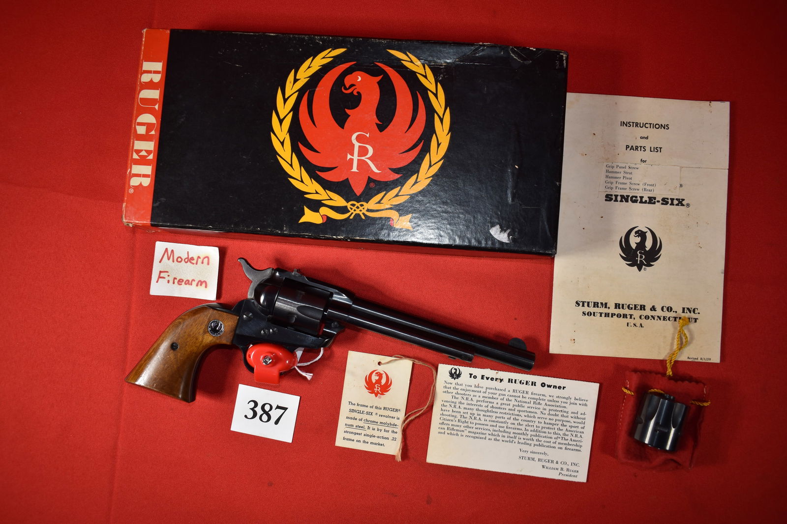 (X) Ruger Single-Six .22 LR Revolver: (X) Ruger Single-Six .22 LR Revolver with .22 magnum cylinder, SN# 332431, 6 ½” bbl., 3 screw early flat top – circa 1960’s, with original box, paperwork, hang tag, few dings on