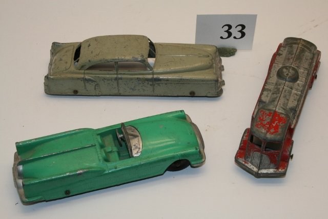 Three metal Tootsietoys: Three metal Tootsietoys: Mack standard oil truck, Buick space car, Cadillac, all approx.. 5 ½” long