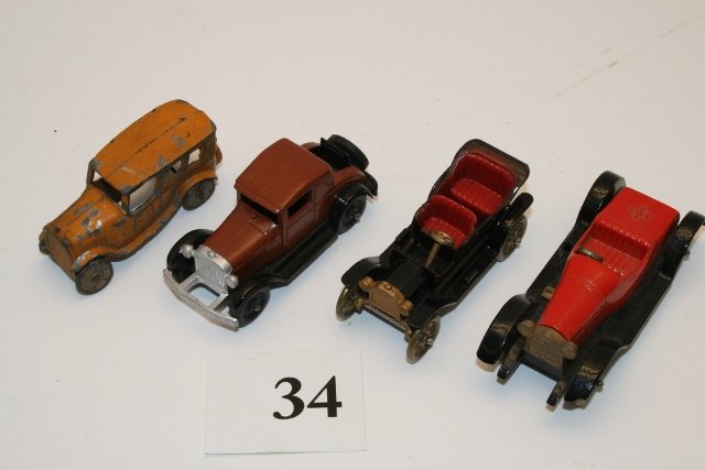 Four metal Tootsietoys: Four metal Tootsietoys: Ford Model T, Ford Model A, Stutz Bearcat, 4 dr. sedan, all approx.. 4” long
