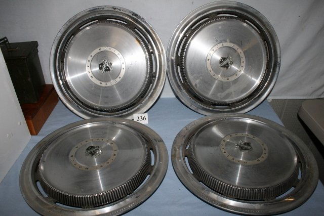 Four 16” Buick hub caps.: Four 16” Buick hub caps.