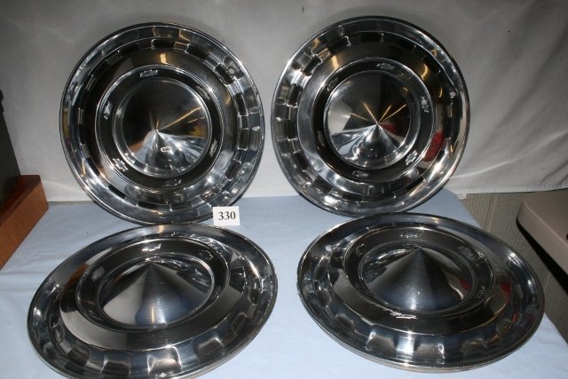 Four 1956 Chevrolet Bel Air hub caps: Four 1956 Chevrolet Bel Air hub caps, some paint faded or missing otherwise in good condition. 15”