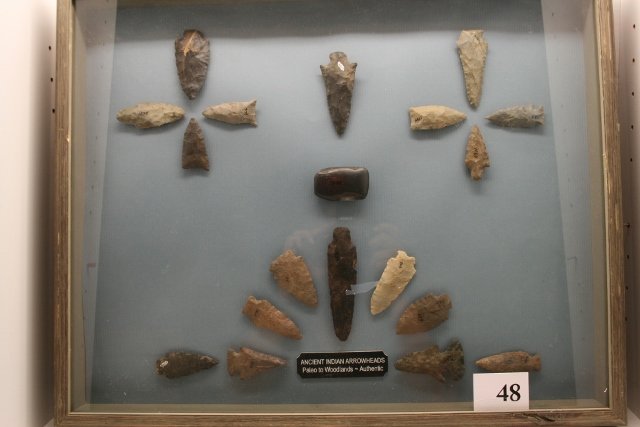 18 Flints and a Hematite Celt: 21” x 17” Frame with 18 Flints and a Hematite Celt with C.O.A. on back, Various States, some Paleo, Largest Flint is 4 ¼”