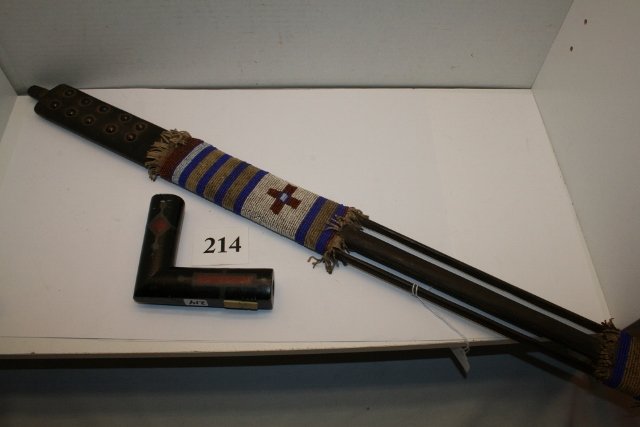 Beaded Wood Brass Tacked Pipe Stem: 28” Finely Beaded Wood Brass Tacked Pipe Stem with fringe décor with 4 ½” x 3 7/8” inlayed elbow pipe and custom made plexiglass display case, circa 1875, Nice!