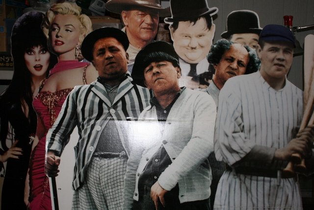 (7) Card Board Cut Outs: (7) Card Board Cut Outs – John Wayne, Elvira, Marilynn Monroe, Laurel & Hardy, 3 Stooges, Babe Ruth – largest 70” tall