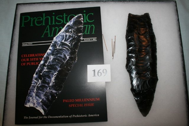 Clovis Point: Lithic Cast of The Famous Rutz Clovis Point – found in Douglas Co. Wash. 9 ¾” long, accompanied by Prehistoric Artifacts pictured on cover