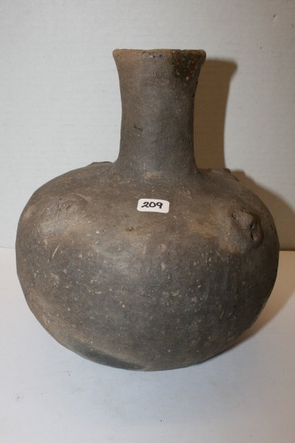 9” x 7 ¾” Water Bottle: 9” x 7 ¾” Water Bottle with 4 Faces on sides, Medallion Faces dug by Bill Rowlett, 1969, Greene Co. Ark.