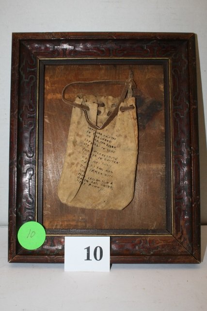 Leather Money Poke: 8 ½” x 10 ½” Rustic Frame containing a 3” x 5” Leather Money Poke with the story of the owner who used it for 22 years for change, he knew Annie Oakley in Dayton, went West in the 1890’s d