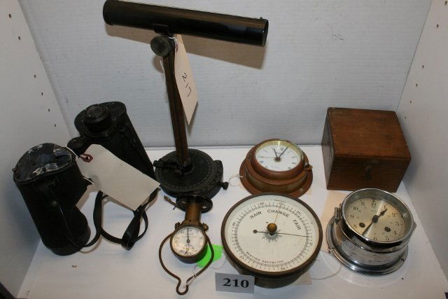 Peloris Drift Site, Salem Ships Bell: Lot Consists of Peloris Drift Site, Salem Ships Bell Chrome Clock, Bass Weather Barometer, Hoffritz Copper-Brass Quartz Clock, France – Brass Pressure Gauge, wood compass box, binoculars – as is
