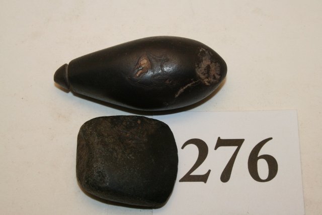 Grooved Top Hematite Plummet: 2 pcs. 2 ½” Grooved Top Hematite Plummet, old tag reads A-N, Ill. And a small hematite celt